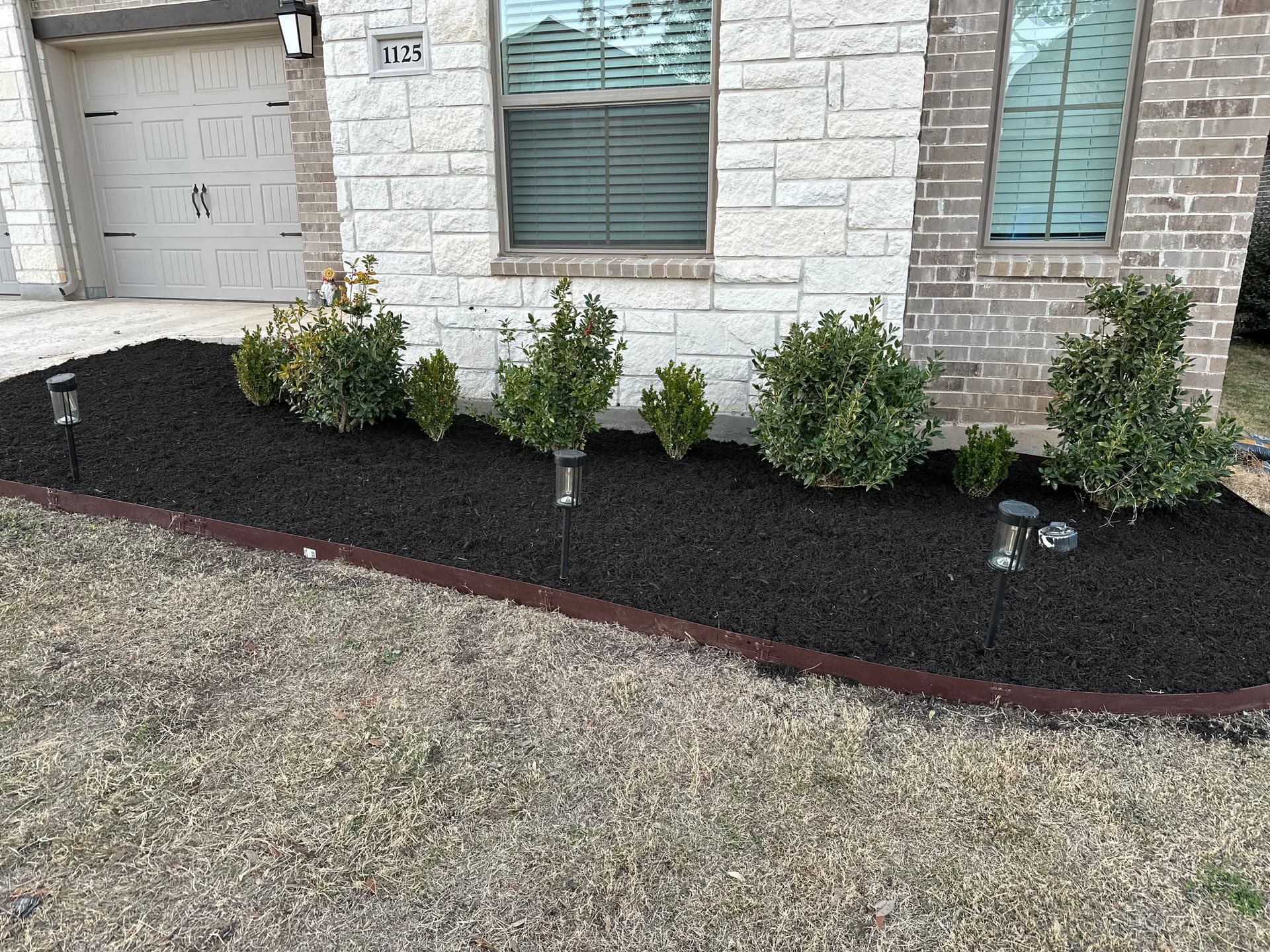 Fresh Mulch Installation Brings Georgetown Home's Front Bed Back to Life image