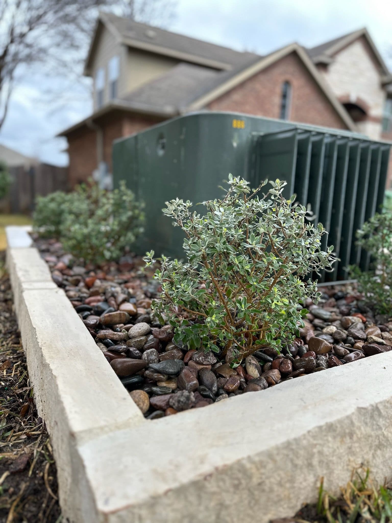 Limestone Planter and Gravel Landscaping image