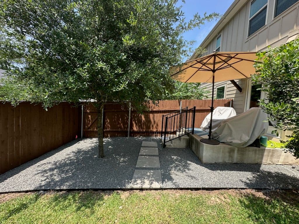 Backyard Transformation with Black Star Gravel and Pavers image
