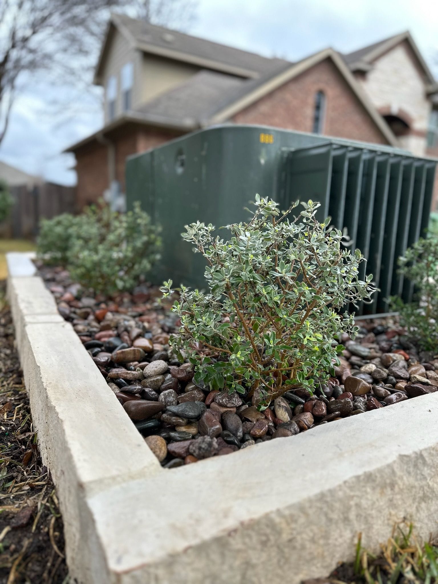 Limestone Planter and Gravel Landscaping